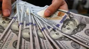 سعر الدولار مقابل الجنيه في تعاملات البنك الأهلي المصري عند 52.29 جنيه